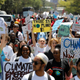 Environmental activists march carrying signs as they take part in the Climate strike protest calling for action on climate change, in Nairobi, Kenya, September 20, 2019.